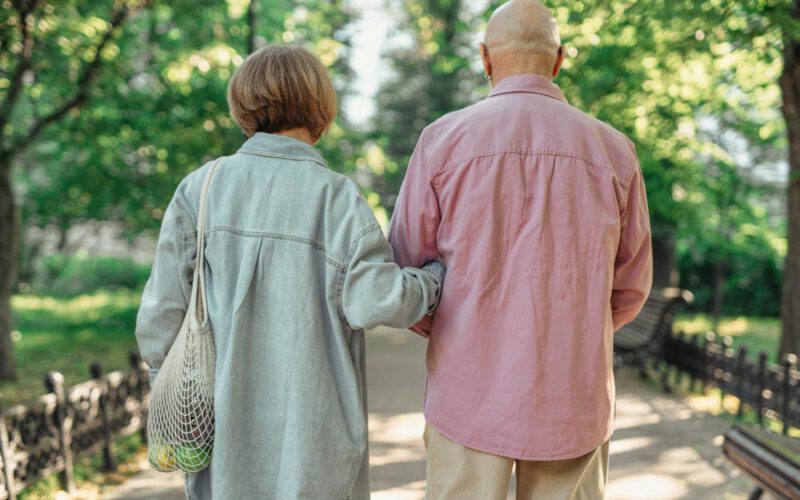 Active couple in their fifties exploring Edmonton neighbourhoods while considering downsizing