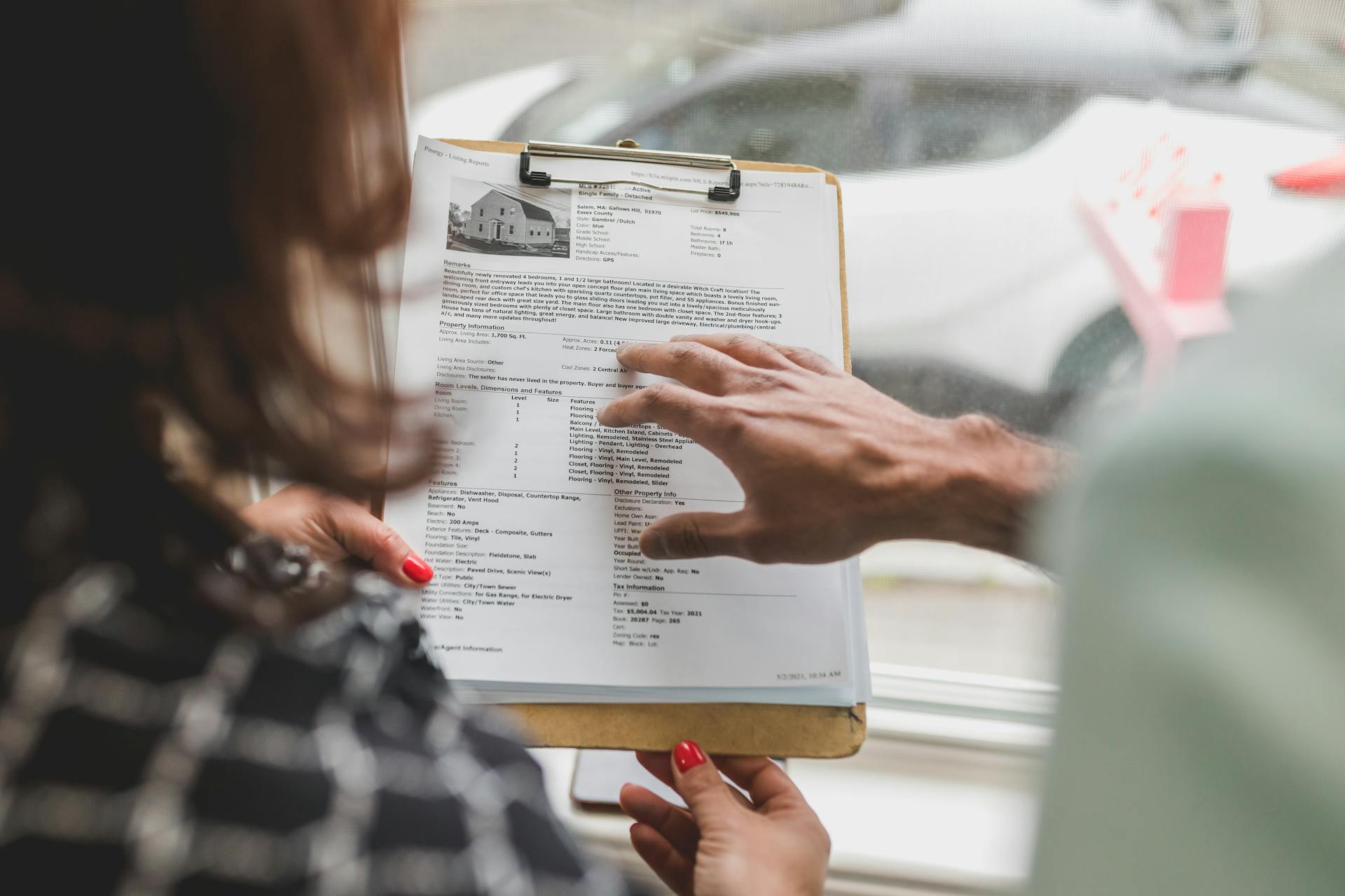 Edmonton real estate closing documents and keys representing completed home sale