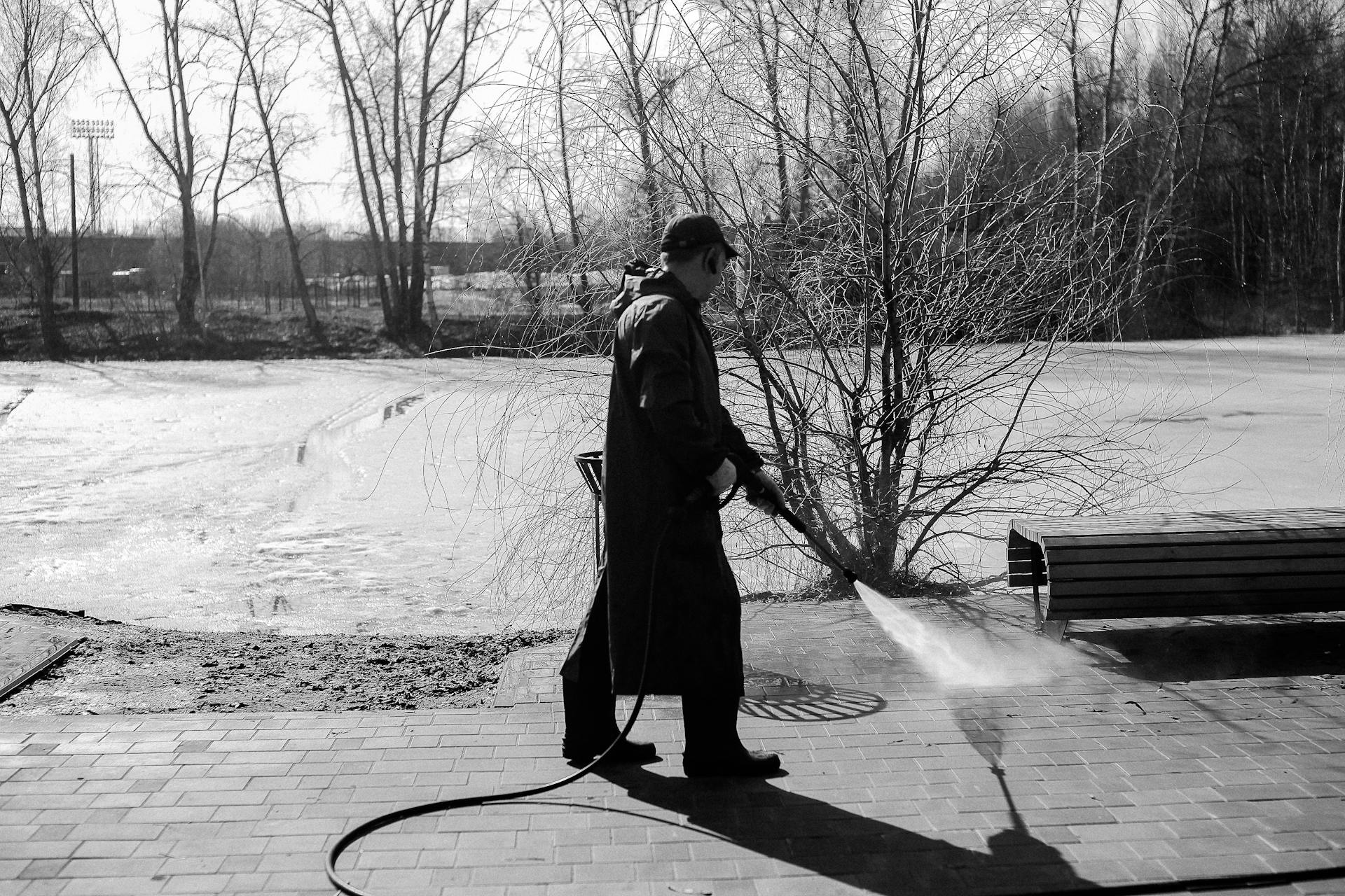 Power washing driveway to boost curb appeal before selling Edmonton home