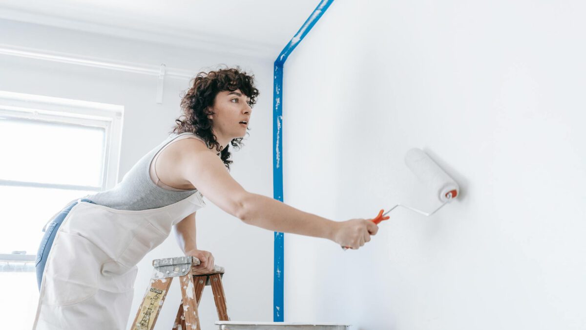 Edmonton homeowner painting walls in neutral colour to prepare home for sale
