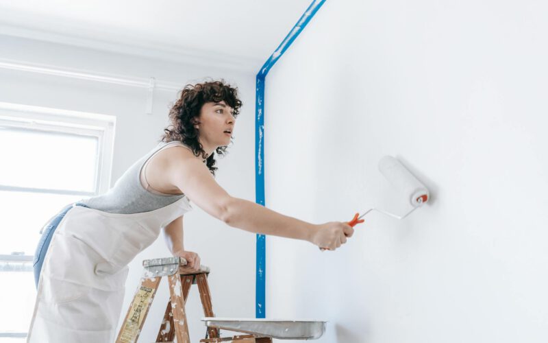 Edmonton homeowner painting walls in neutral colour to prepare home for sale