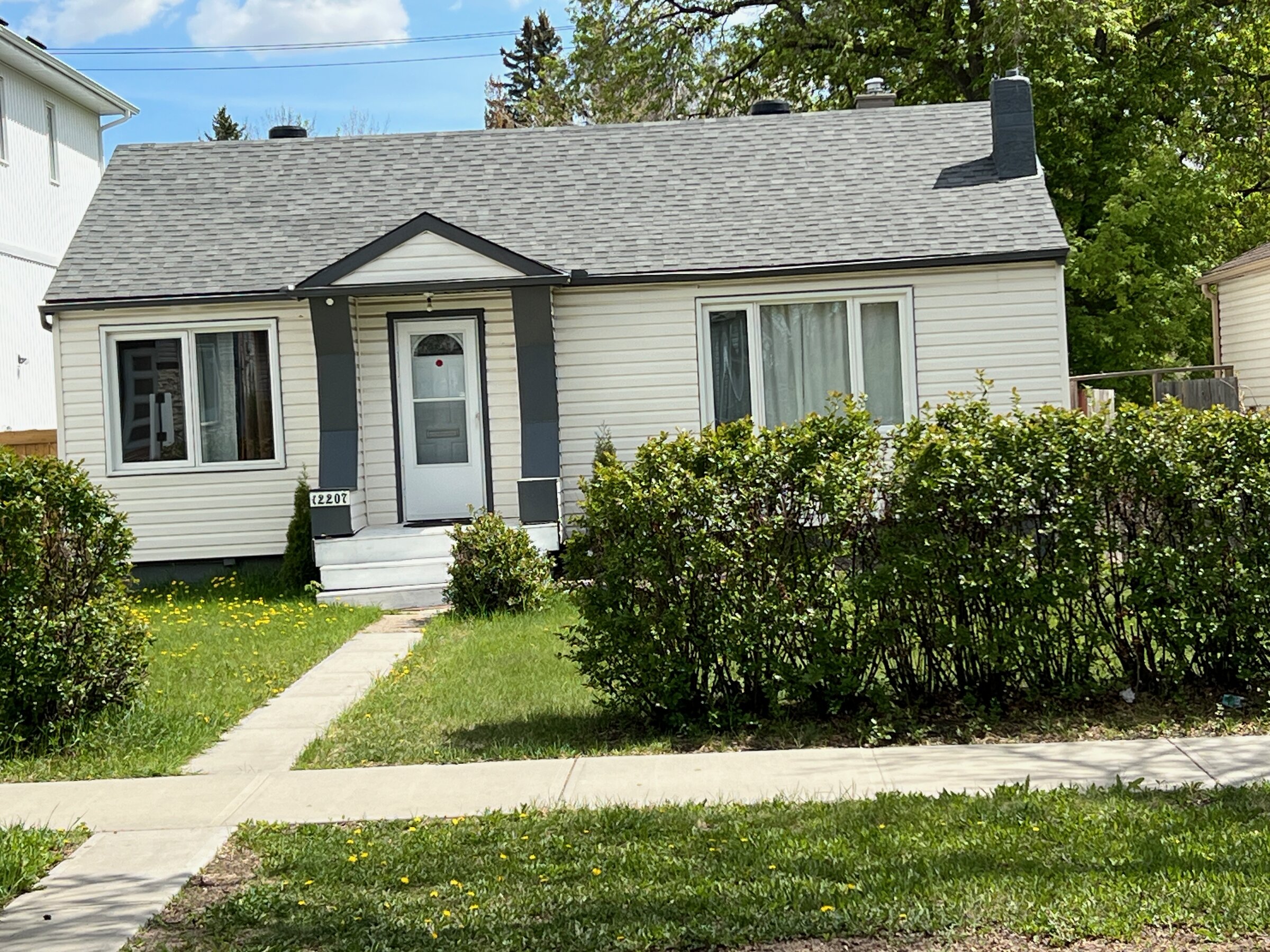 Detached post-war bungalow with mature landscaping and established trees in Sherbrooke, Edmonton
