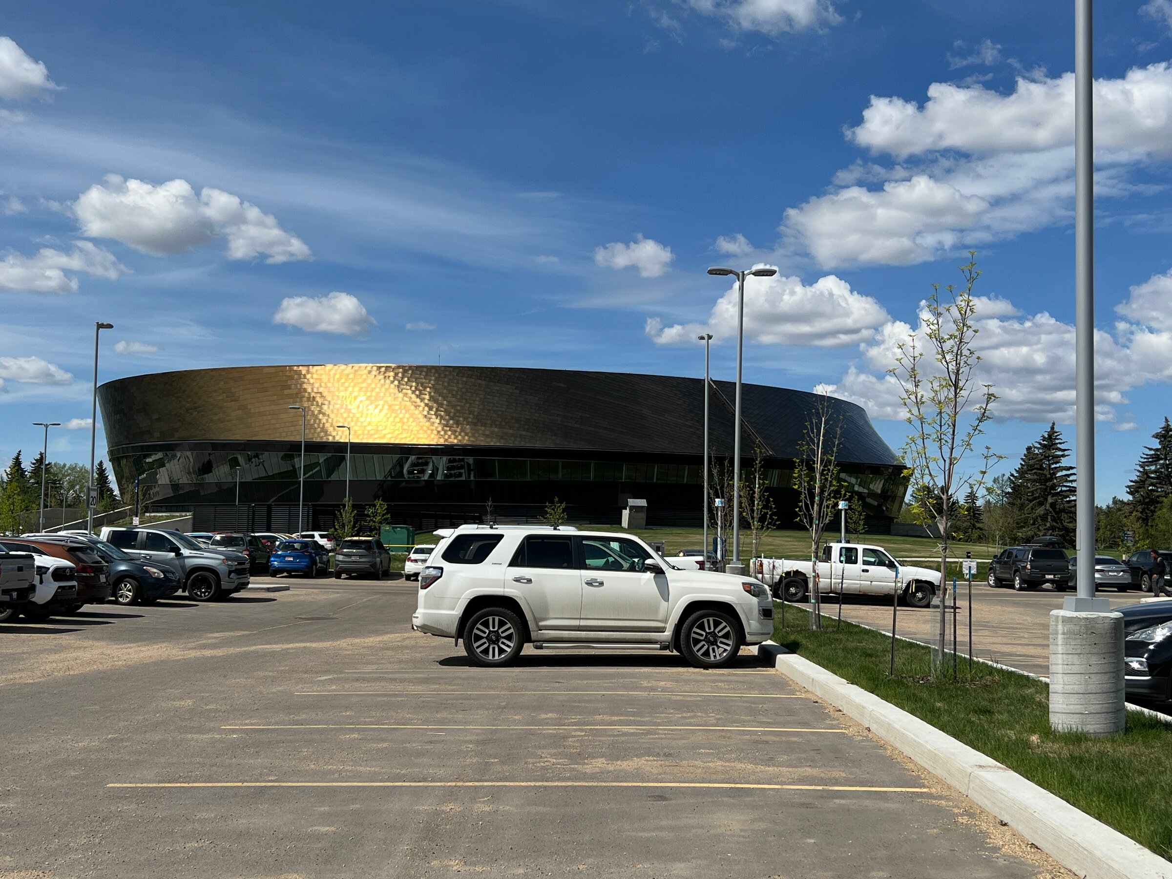 Recreation centre with a distinctive curved metallic roof at Coronation Park in Woodcroft, Edmonton