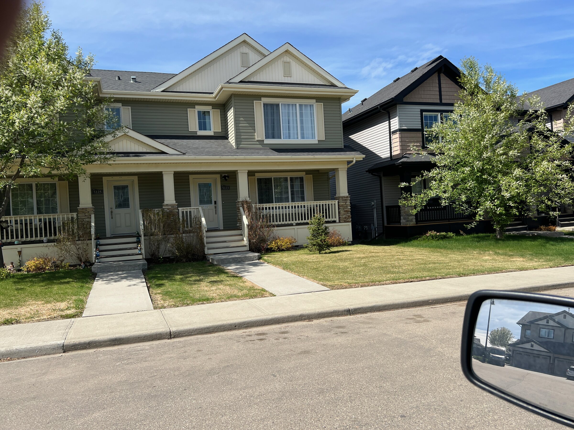 A two-storey detached home with a covered front porch in Granville, Edmonton